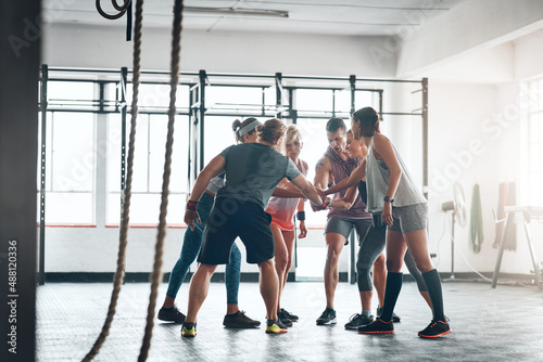 Were in this together. Shot of a fitness group working out at the gym.