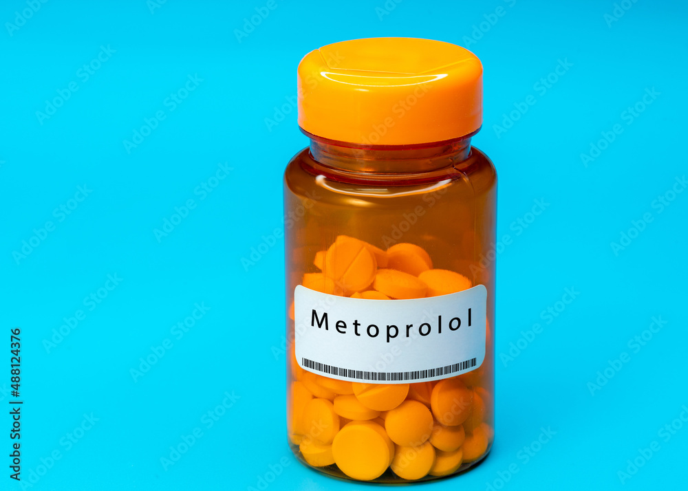 Medical vial with Metoprolol pills. Medical pills in orange Plastic Prescription Medical vial with Metoprolol pills. Medical pills in orange Plastic Prescription