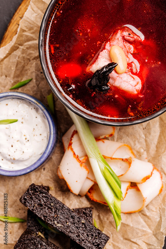Red borscht with rye croutons and pieces of lard. Menu concept. photo