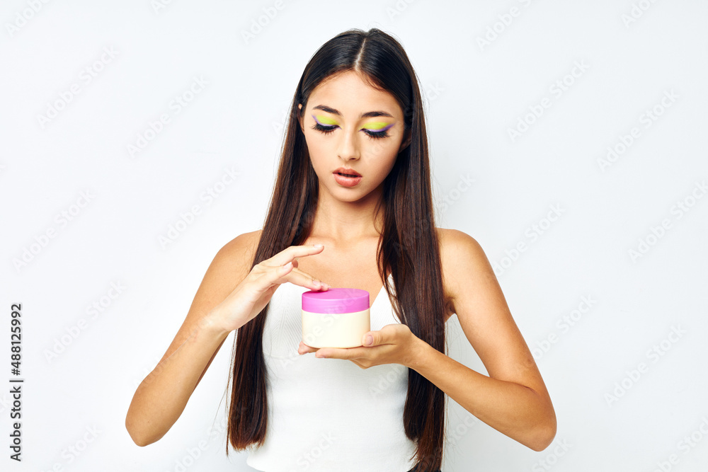 young woman bright makeup posing skin care isolated background unaltered young woman bright makeup posing skin care isolated background unaltered