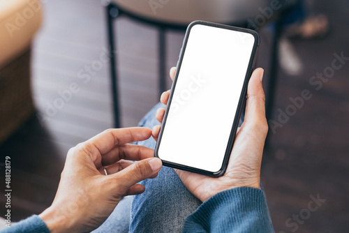 cell phone blank white screen mockup.hand holding texting using mobile on desk at office.background empty space for advertise.work people contact marketing business,technology