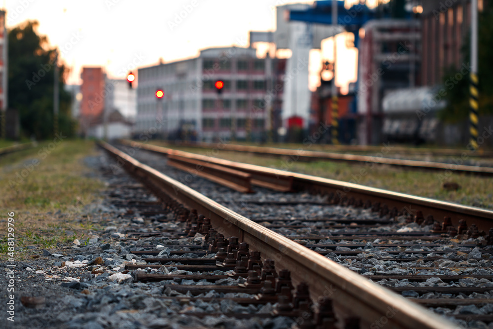 Railroad track at industrial area. Selective focus. Rail transportation. Railway in city