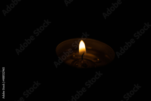Candle flame at night in total darkness