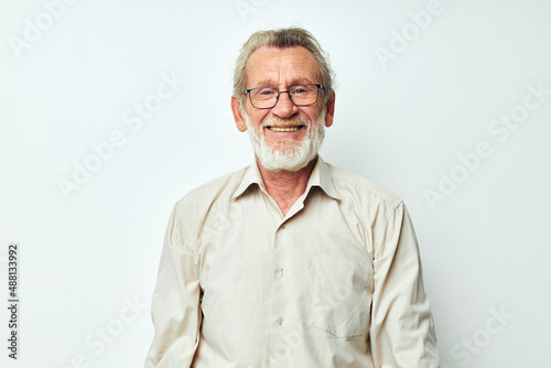 Portrait elderly man wears glasses in shirts isolated background © Tatiana