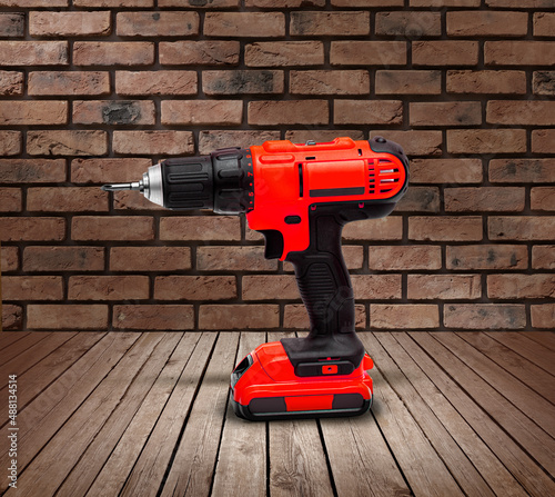 Red electric cordless screwdriver drill