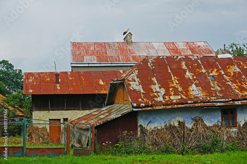 Old rural buildings with rusty roofs