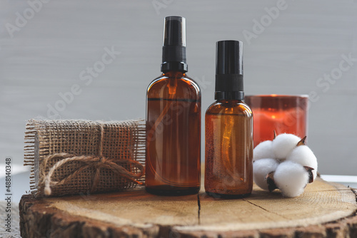 Set of natural oils for face and body care on a wooden background. SPA concept photo