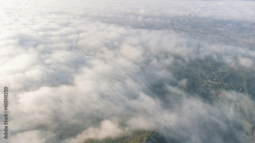 Sea of Fog covers the area on the top of hill Doi Phu Thok, Chiang Khan, Loei, Thailand with background of sunrise on winter. 