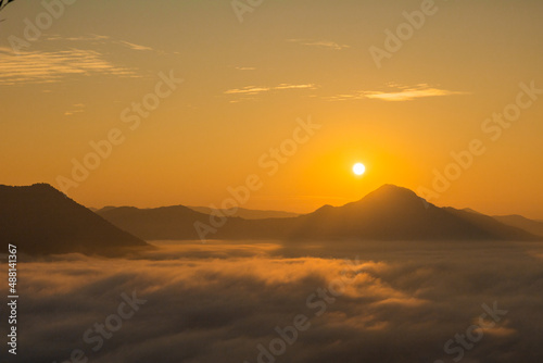 Sea Fog and Golden sunrise covers the area on the top of hill Doi Phu Thok  Chiang Khan  Loei  Thailand with background of sunrise on winter. 