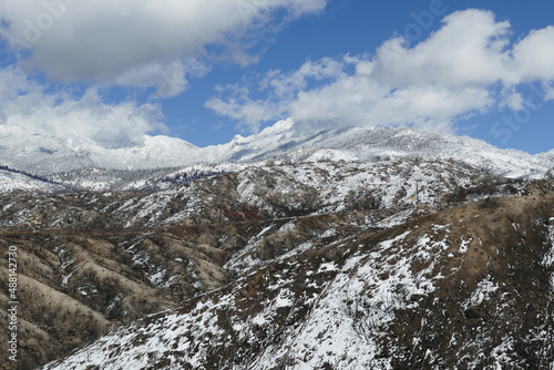The snow-covered San Jacinto Mountains on a winter day, as seen from the Pines to Palms Highway, Southern California, USA. 