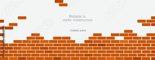 Website is under construction text and brick background.	 photo