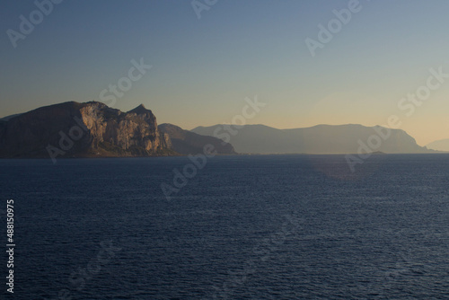 evocative image of sea coast with promontory on the background in Sicily  Italy