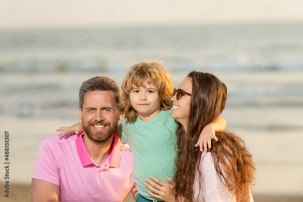 happy family of mom dad and kid on summer beach happy family of mom dad and kid on summer beach