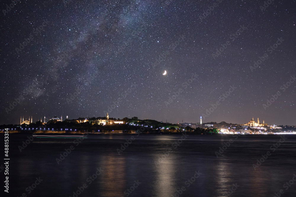 Istanbul and Milky Way. Cityscape of Istanbul at night. Photo manipulation. Noise included.