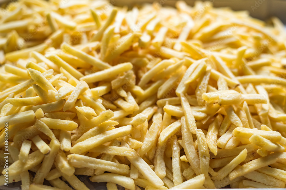 Close-up of delicious potato chips as background. Close-up of delicious potato chips as background.