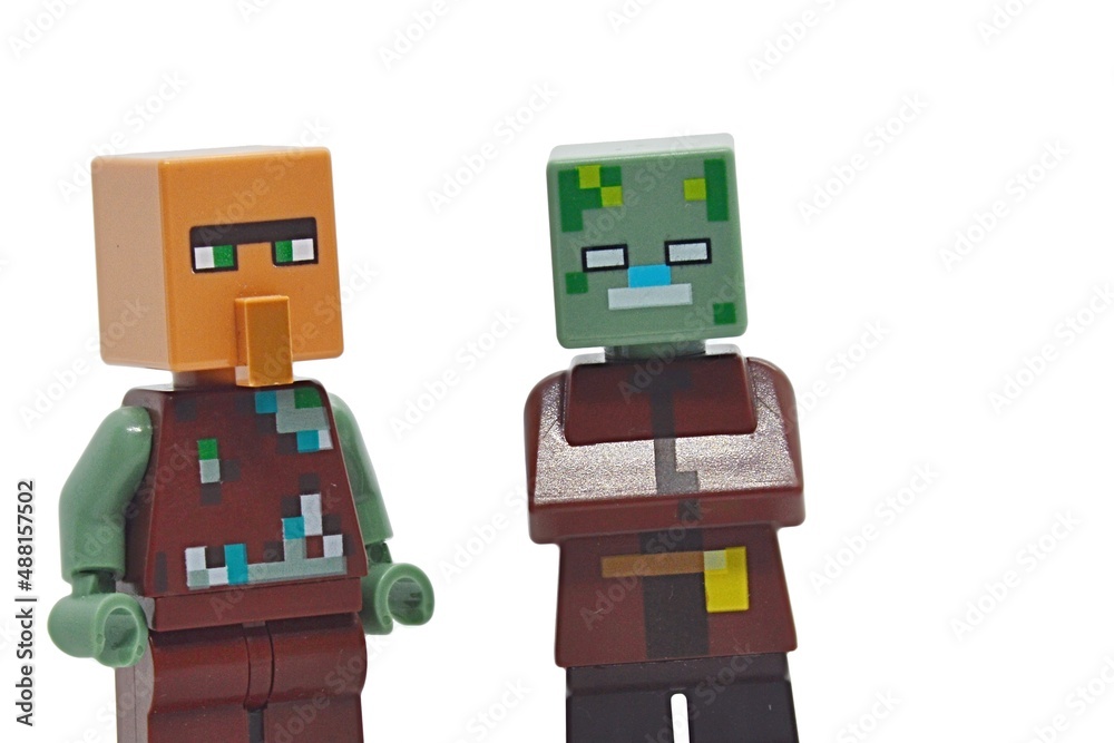 LEGO Minecraft switched heads - villager head with body of drowned zombie and zombie head with body of villager. White background Stock Photo | Stock