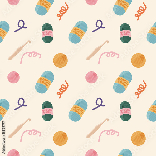 Cute seamless background with wool and knitting tools on it. Concept of handmade workshop. Pattern, backdrop, texture for wrapping paper, scrapbooking and web. Vector illustration