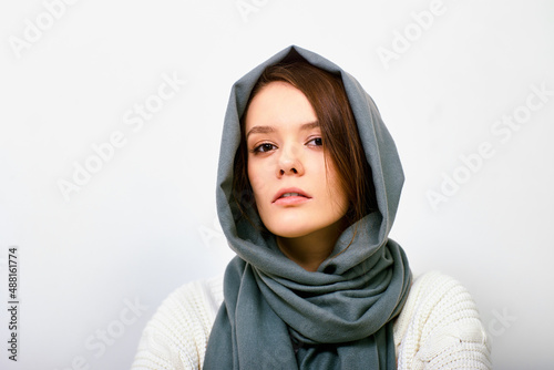 Young woman in headscarf or hijab inside. photo