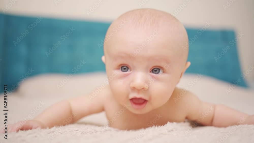 Funny and beautiful baby on the bed. children's health. Funny and beautiful baby on the bed. children's health.