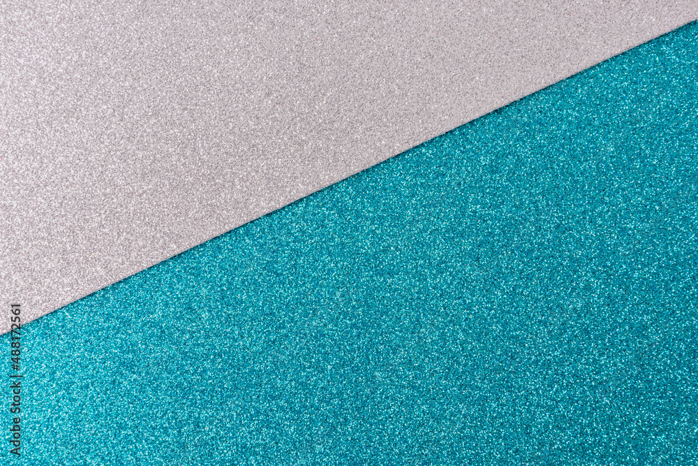 Shiny and glittering surface. Silver and blue, turquoise, abstract background. Events, celebrations. Trendy backdrop for your design. Texture with glitter. Shiny and glittering surface. Silver and blue, turquoise, abstract background. Events, celebrations. Trendy backdrop for your design. Texture with glitter.