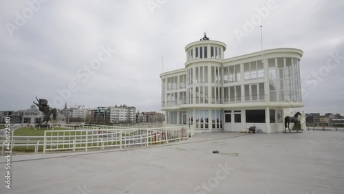 Part of the Hippodrome Wellington (Wellingtonrenbaan) with Belgian king Leopold II crown on top of the building. Horse racing track in Ostend, Belgium - Wide shot photo