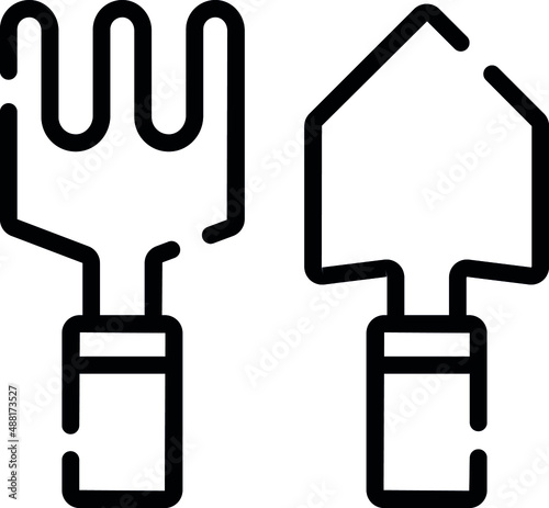 Farm working in fields with fork and trowel