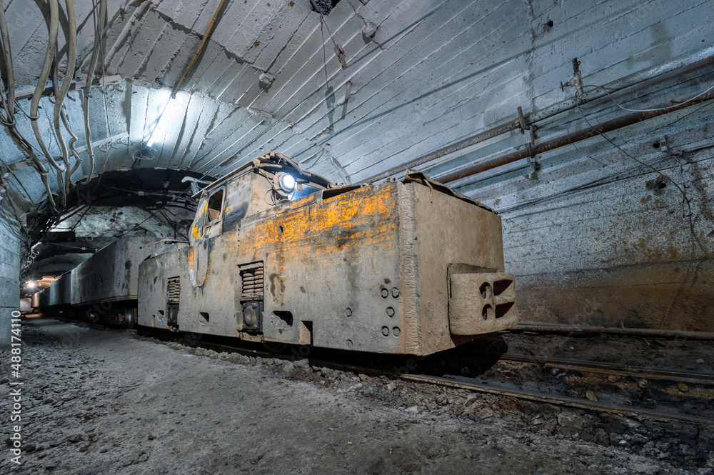 Electric locomotive in an underground tunnel Electric locomotive in an underground tunnel