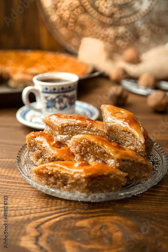 Baklava with nuts on a wooden background. Selective focus.