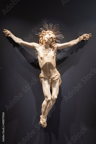 Jesus Christ - Old crucifix, Catholic Church, on black background with copy space.