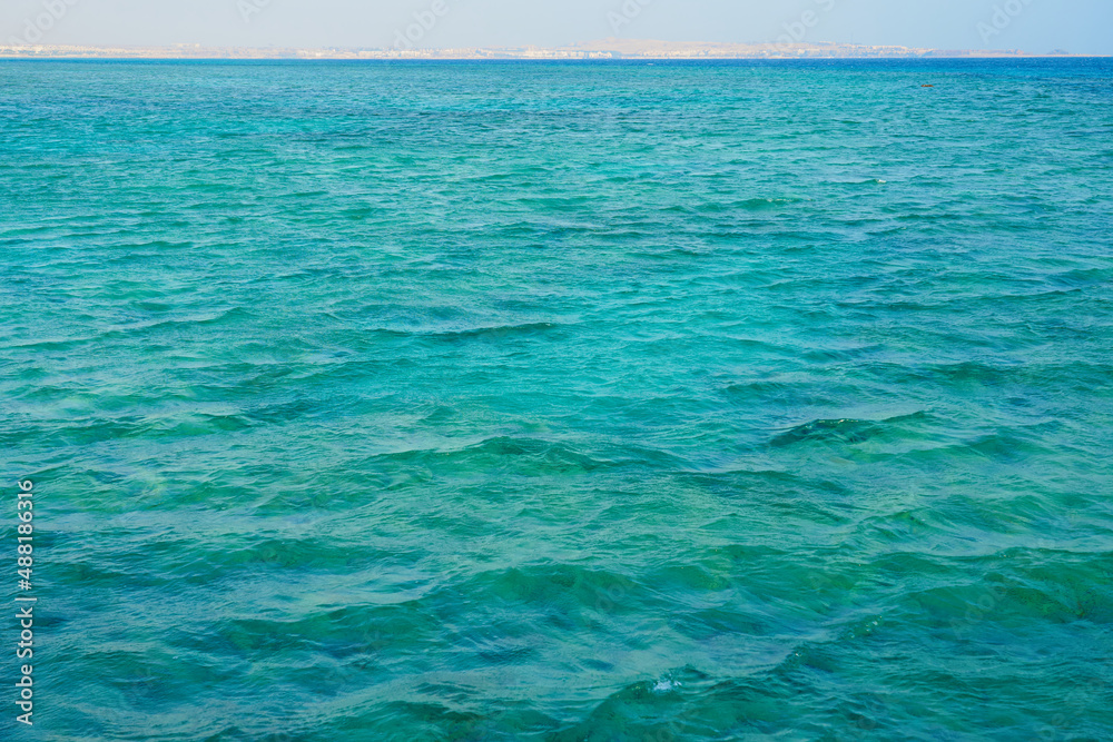The surface of the water of the Red Sea with a horizon in the background.