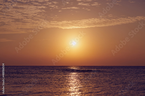 The sun rises over the Red Sea at dawn.