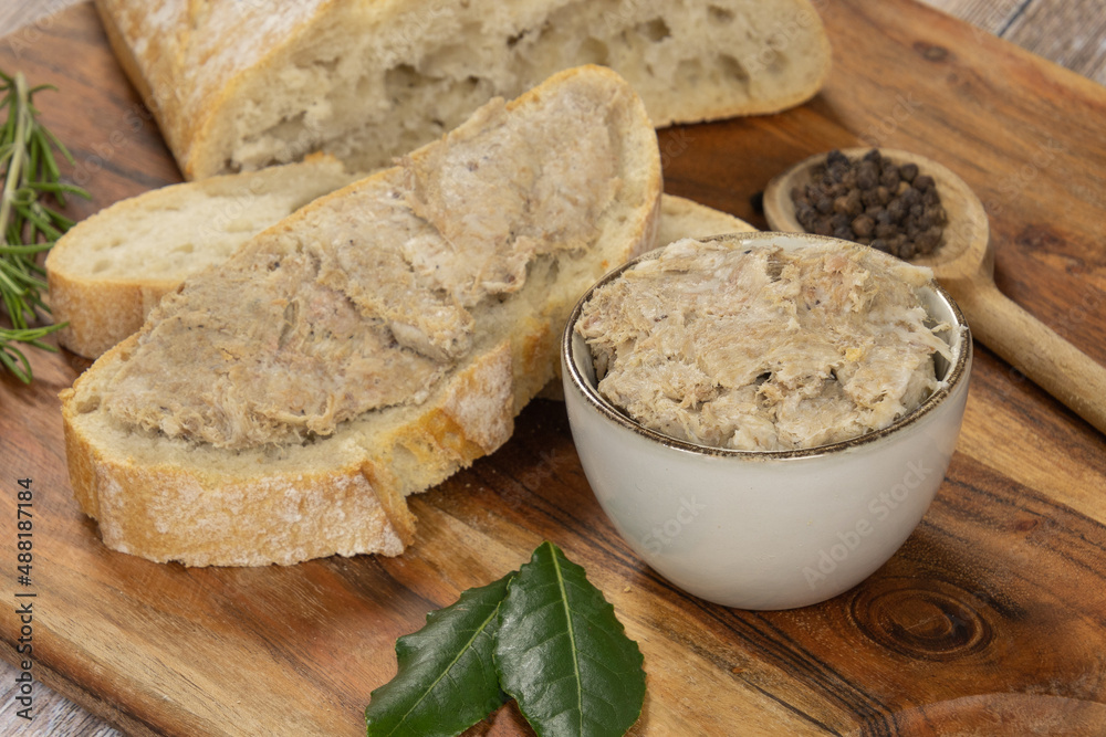 slice of bread with rillette on a wooden board slice of bread with rillette on a wooden board