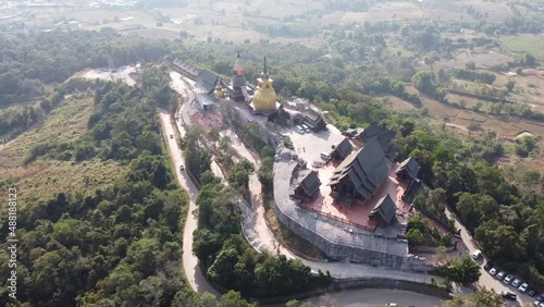 Wat Somdet Phu Ruea Ming Mueang Temple 4k fly over aerial view. Temple is built with fine wood timber. The church is made of teak and locate on mountain and best viewpoint at Phu ruea, Loei, Thailand photo