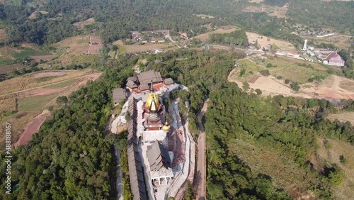 Wat Somdet Phu Ruea Ming Mueang Temple 4k fly over aerial view. Temple is built with fine wood timber. The church is made of teak and locate on mountain and best viewpoint at Phu ruea, Loei, Thailand photo