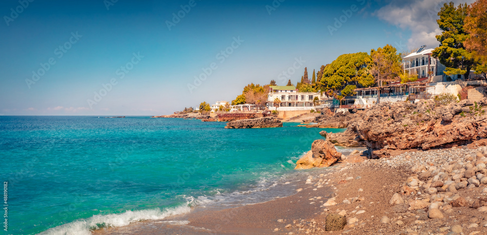 Panoramic spring view of publik beach in Dhermi town. Picturesque morning seascape of Adriatic sea. Stunning spring scene of Albania, Europe. Vacation concept background..