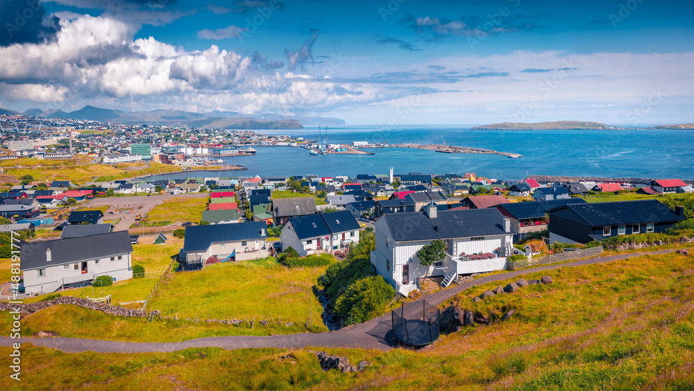 Attractive summer sityscape of Torshavn town. Impressive morning scene of Streymoy island, Faroe, Denmark, Europe. Traveling concept background.