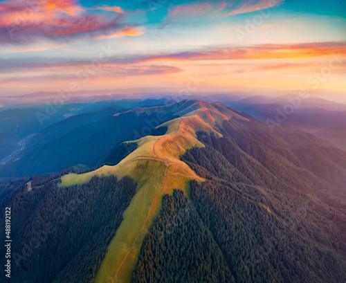 Fantastic summer sunrise on Menchul ridge. Adorable morning view from flying drone of Carpathian mountains. Beauty of nature concept background. photo