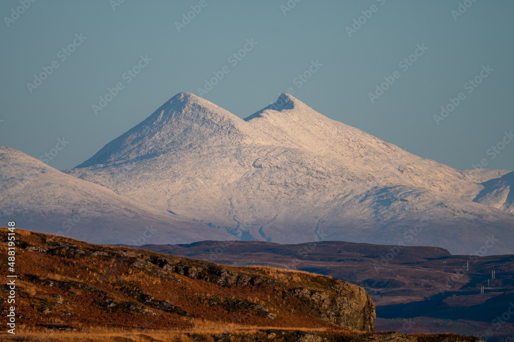 A snow covered Ben Cruachan in the Scottish Highlands photographed from the Isle of Mull
