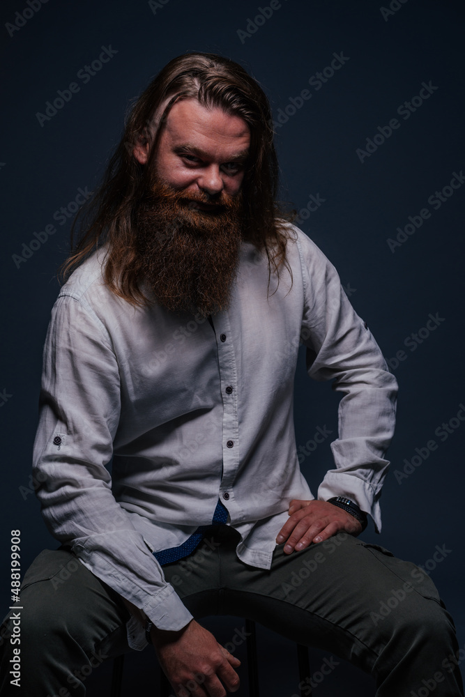 Close up portrait of handsome manly guy with beard posing in studio on a isolated background. Close up portrait of handsome manly guy with beard posing in studio on a isolated background.