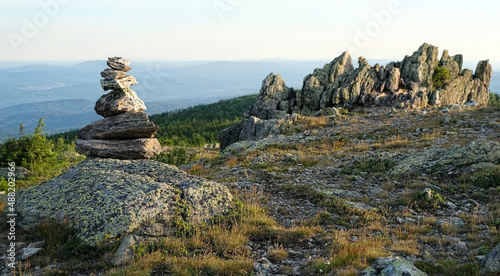 summer landscape with mountains. big old stones, slope rocks natural background. travel trip, journey, hiking, adventure, concept. National Park Taganay, Southern Ural, Russia photo
