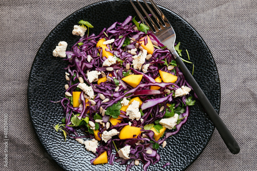 Home made red cabbage mango salad with vegan feta