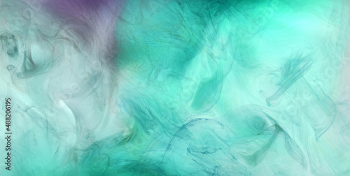 Green smoke on white ink background  colorful fog  abstract swirling emerald ocean sea  acrylic paint pigment underwater