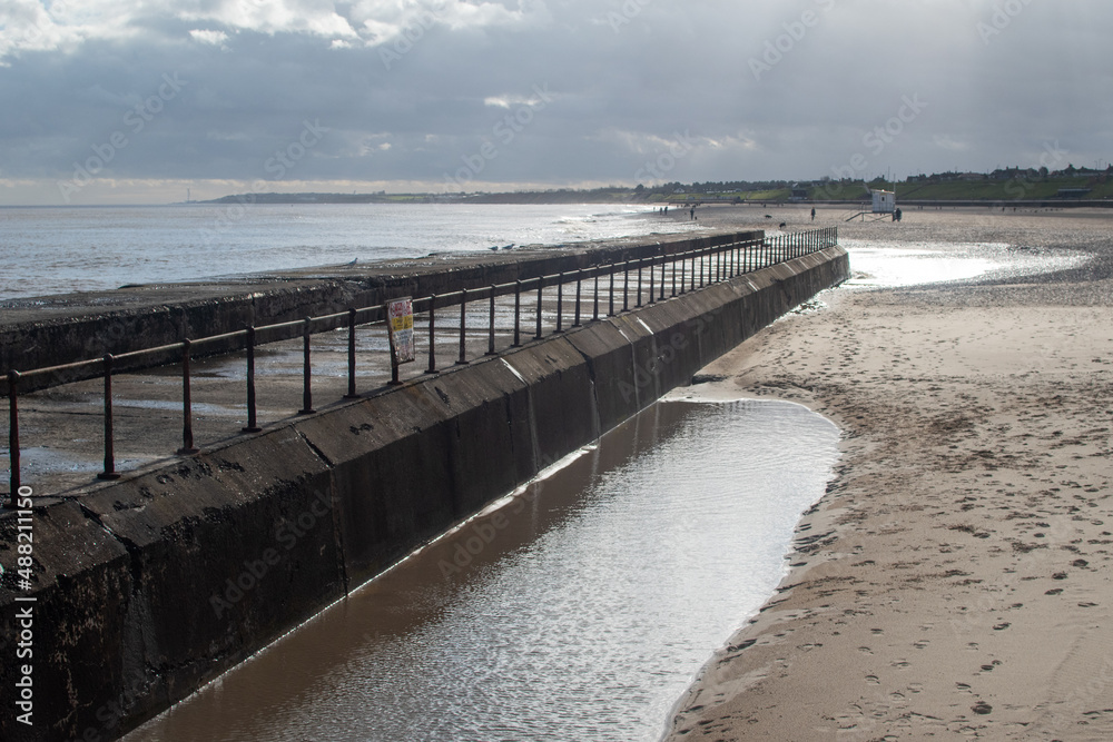 Sea defences/wall barrier with views looking towards the beach at Gorleston-on-sea in Norfolk, UK
