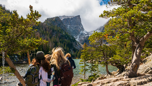 Hikers look at Hallett Peak and Dream Lake at the Rocky Mountain National Park. photo