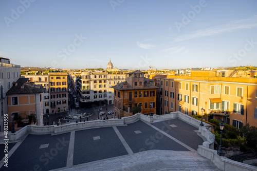 Cityscape view on the old town from the top of famous Spanish stairs in Rome on a sunny day. Traveling Italian landmarks concept. Architecture and buildings in Rome © rh2010