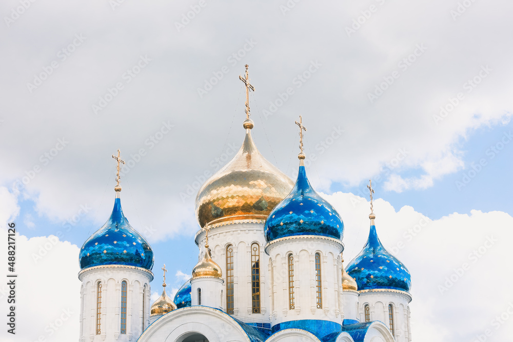 Blue and golden domes of white orthodox church Blue and golden domes of white orthodox church