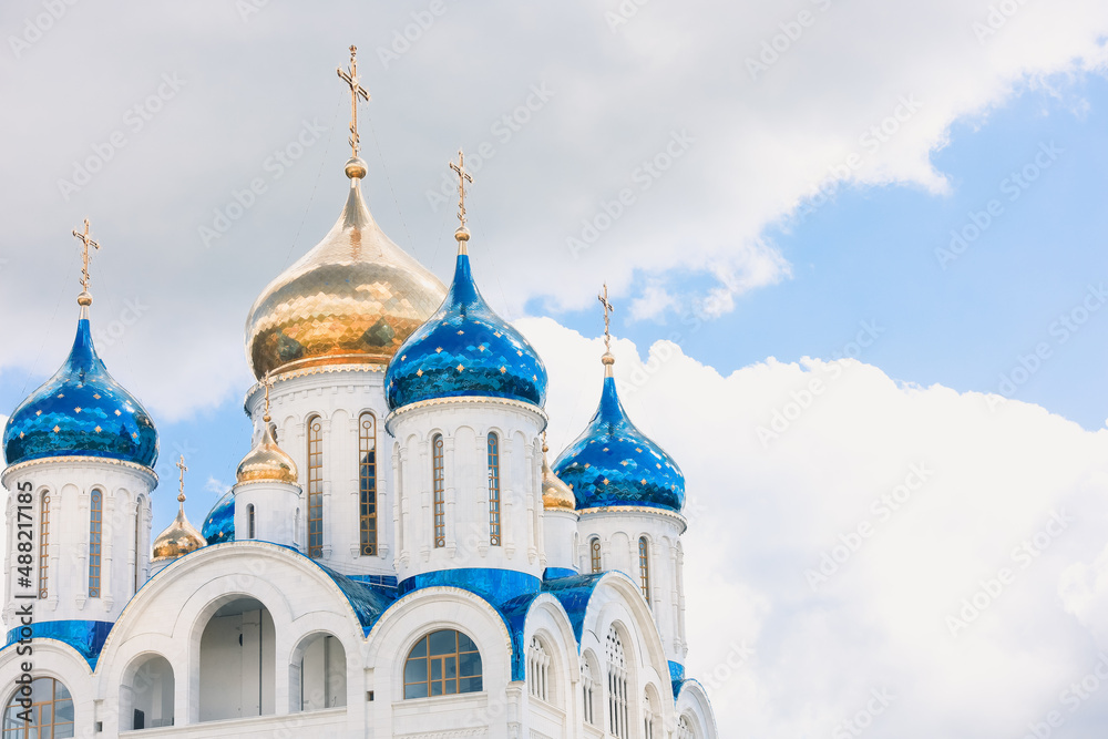 Blue and golden domes of white orthodox church Blue and golden domes of white orthodox church