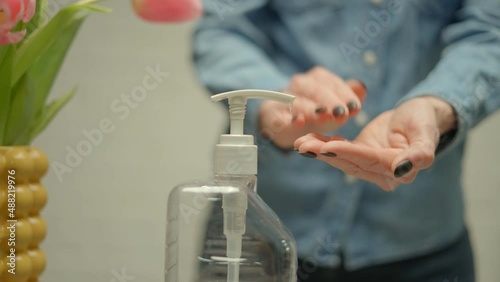 Women washing hands with alcohol gel rub clean hands hygiene prevention and disinfection of coronavirus. photo