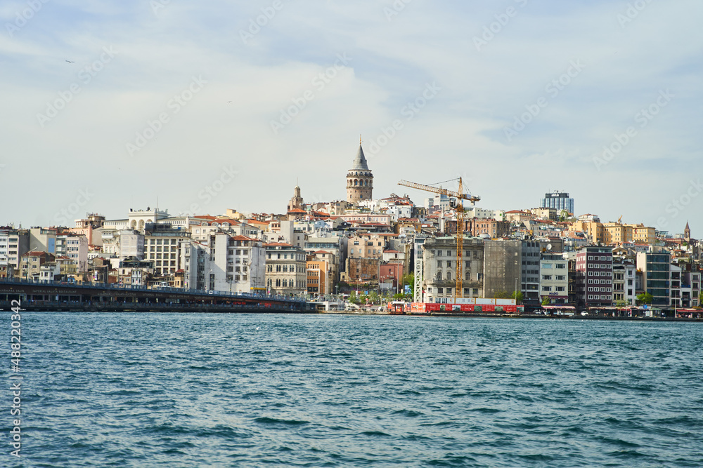 View of the Galata Tower across the Bosphorus Bay from the Fatih area. Istanbul, Turkey