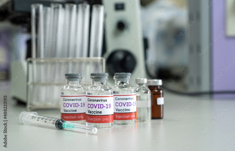 Concept vaccine against covid-19 coronavirus Omicron BA.2 , a bottle of vaccine in a scientific laboratory that is a prototype for invention and development.